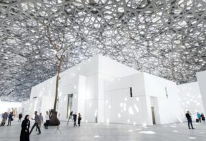 A wide view of the interior of the Louvre Abu Dhabi with a silver-toned dome ceiling. | Image credit and source: Christopher Pike / The National