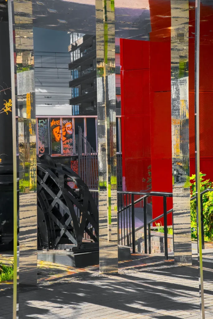 A bright red building stands prominently against a clear blue sky.